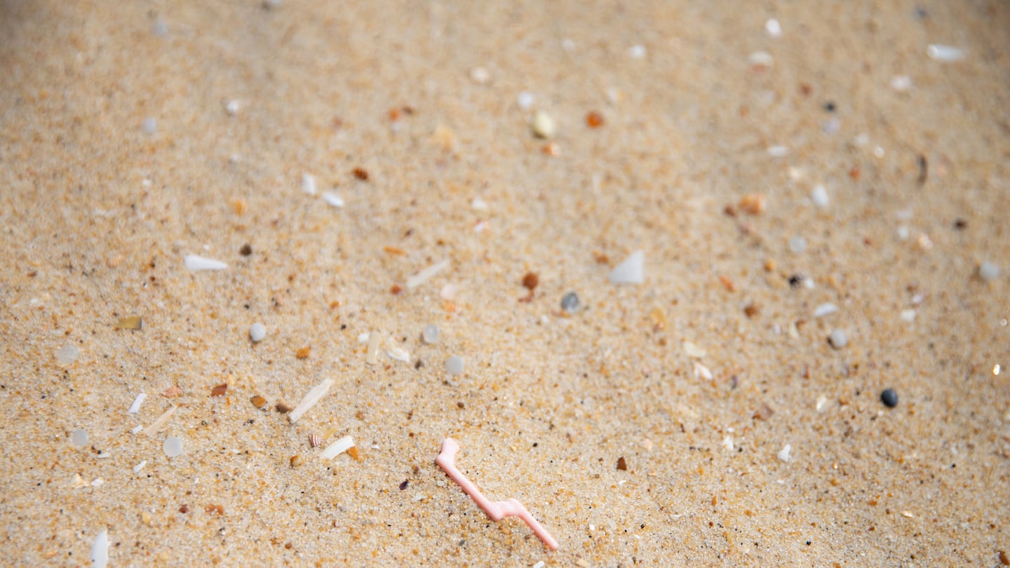 Plastics and micro plastics of different shapes and colors are laid on the fine sand of the Grand Crohot beach in Lege-Cap-Ferret in New Aquitaine in France on August 06 2022.