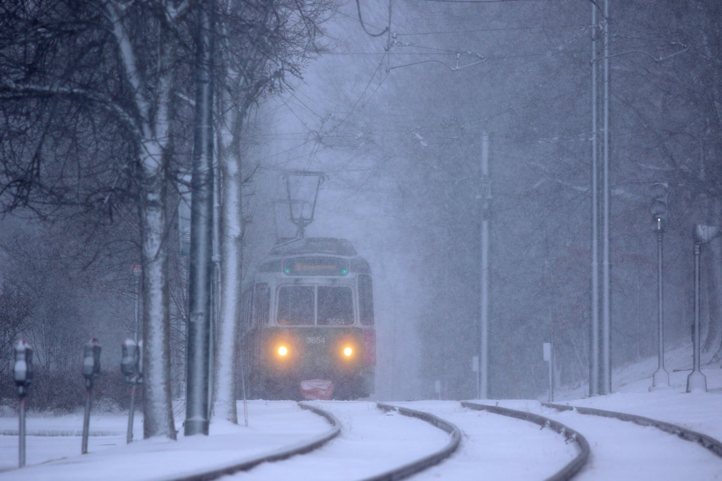 An MBTA Green Line C train trundled inbound to Boston during heavy snowfall in Coolidge Corner in 2017