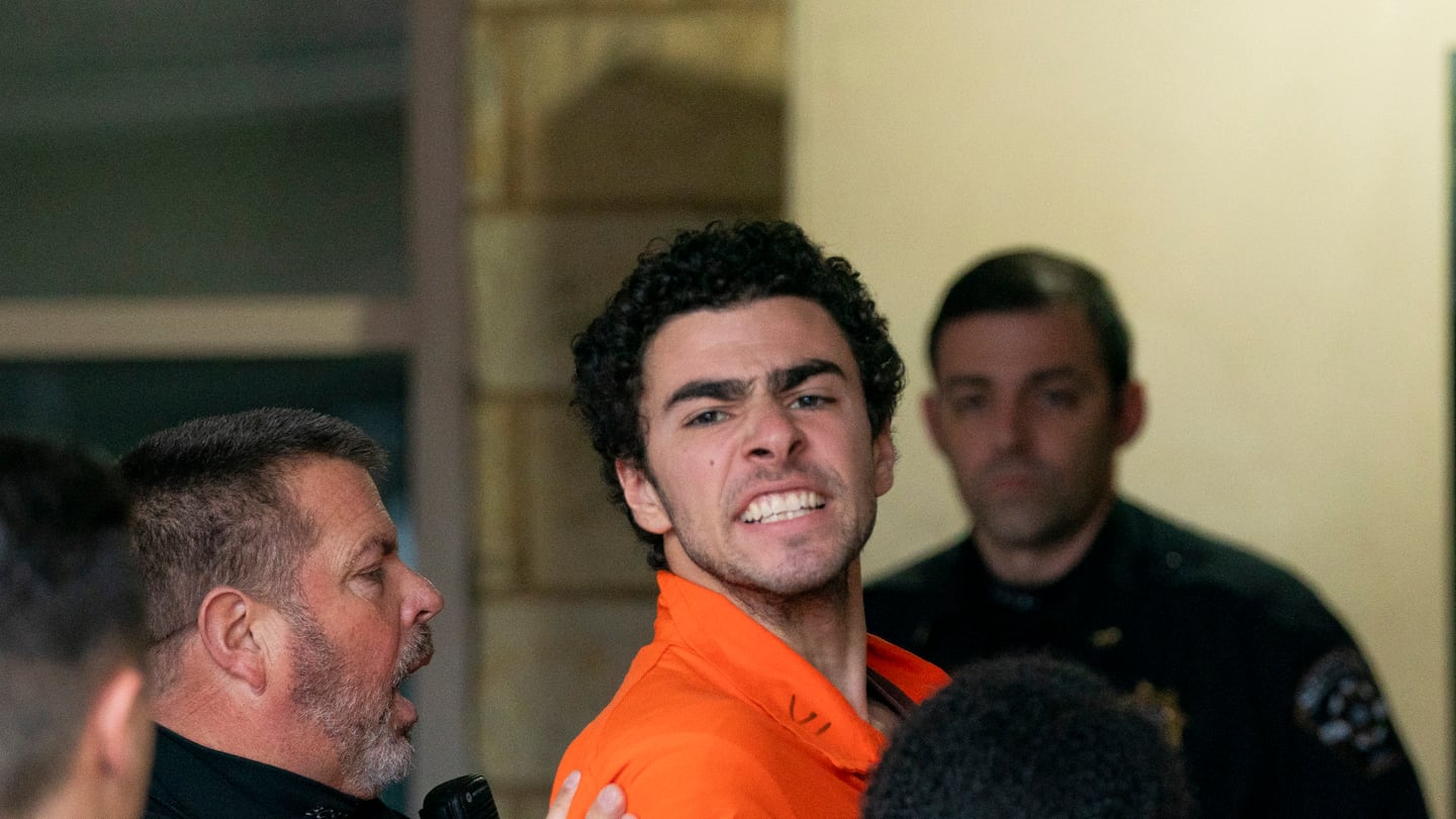 Suspect Luigi Mangione is taken into the Blair County Courthouse on Dec. 10, in Hollidaysburg, Pa.