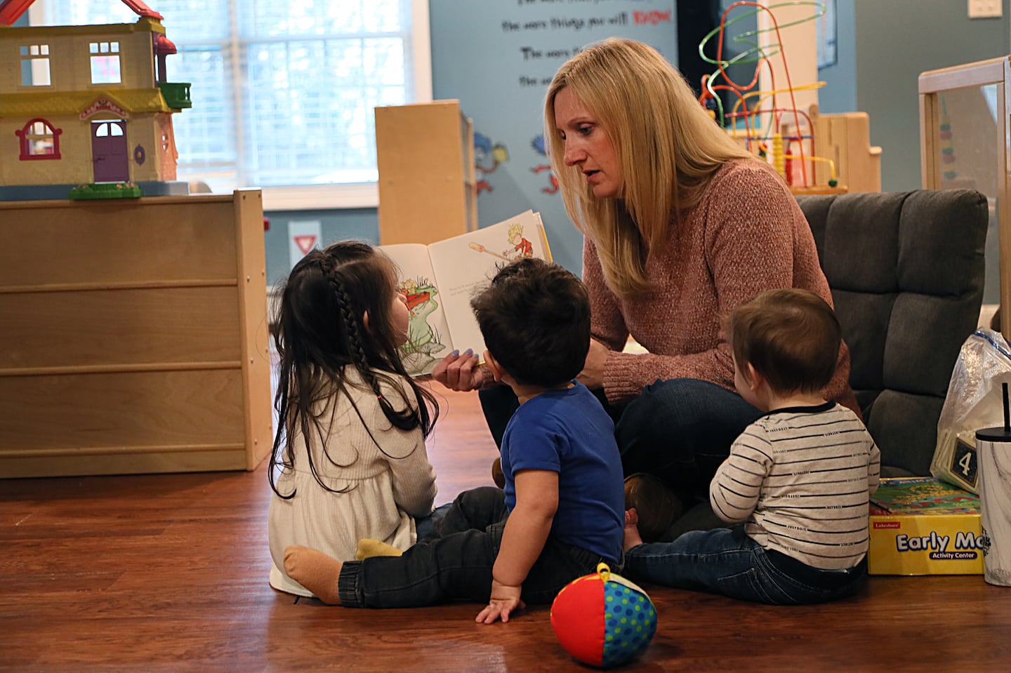 Jennifer Simpson reads to the children in her day care, Brilliant Beginnings Daycare.