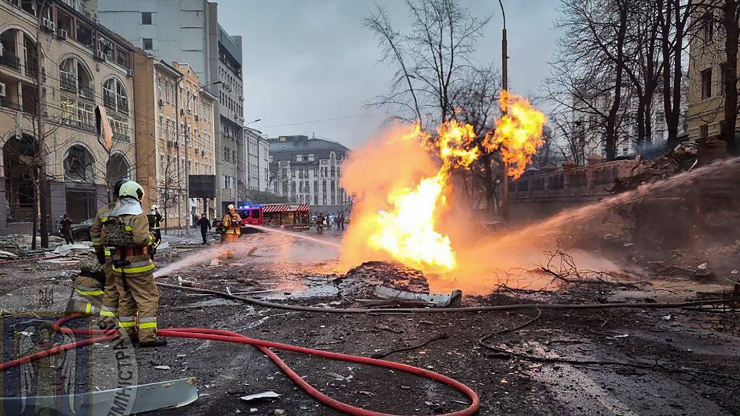 Firefighters work on the site after a Russian missile attack in Kyiv, Ukraine, on Dec. 20.