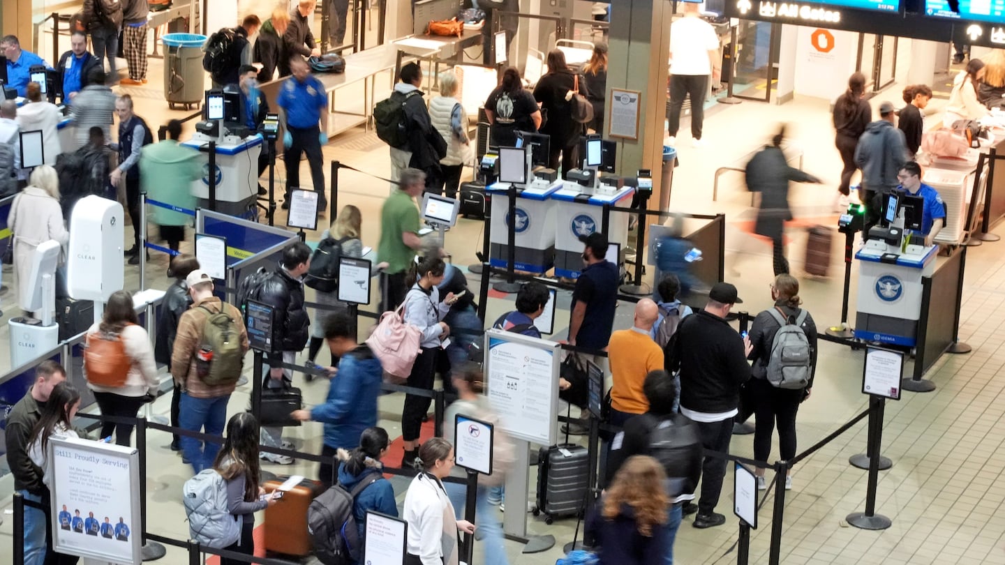 Passengers line up at the security checkpoint in Pittsburgh International Airport, on Dec. 11.