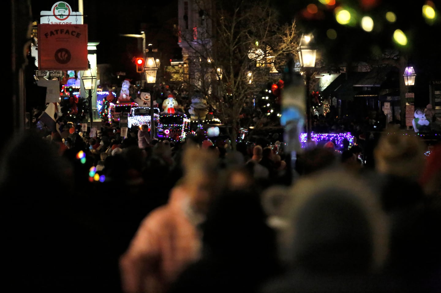 People gather to watch the annual holiday parade and tree lighting ceremony in Portsmouth, N.H., Saturday, Dec. 7, 2024.