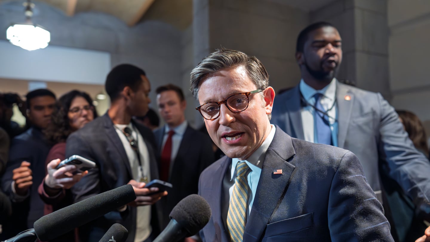 Speaker of the House Mike Johnson emerges from a closed-door meeting with fellow Republicans at the Capitol in Washington, Friday, Dec. 20, 2024.