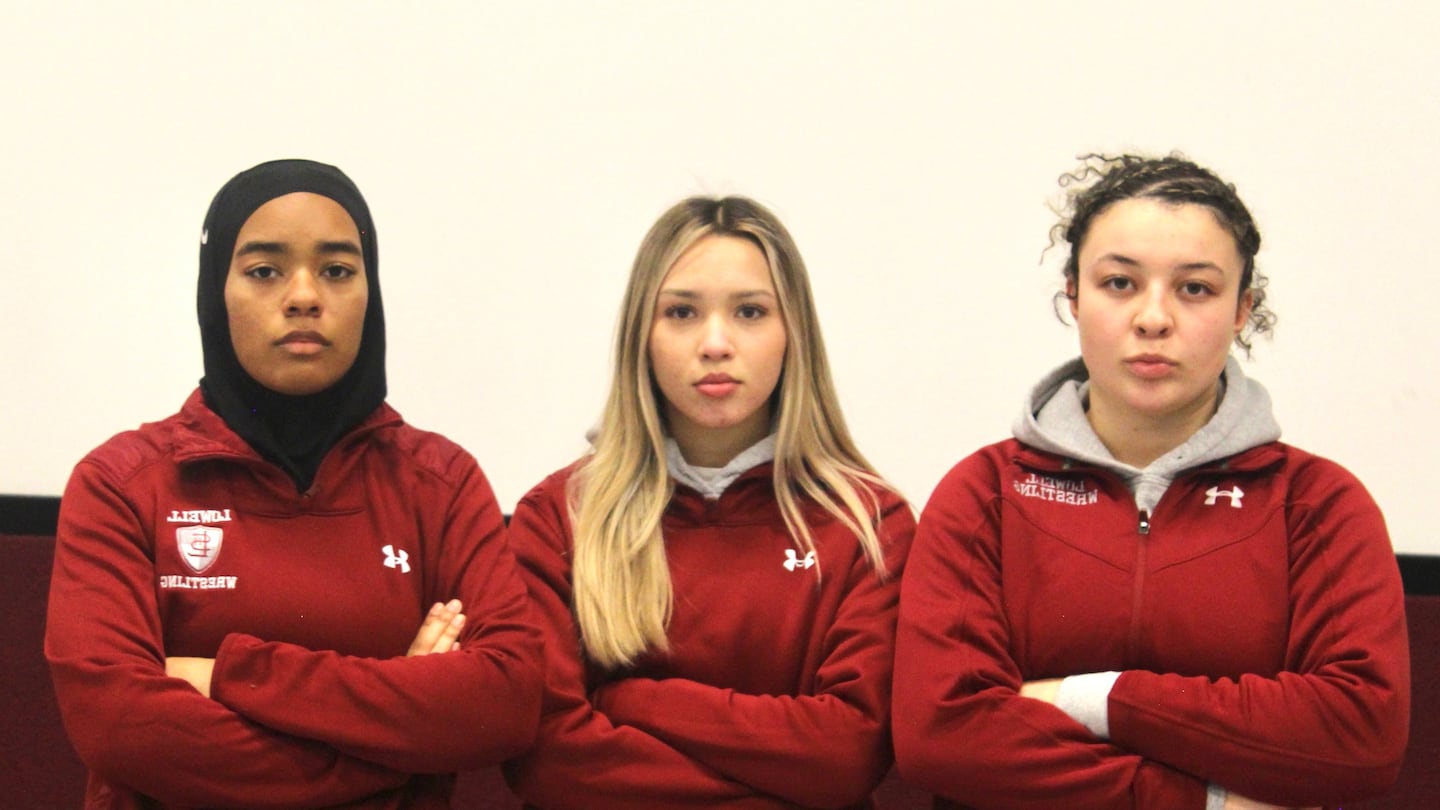 The first three females to join the Lowell wrestling team were, from left, Amada Moundele, Saphira Sao, and Amelyiah Martinez.