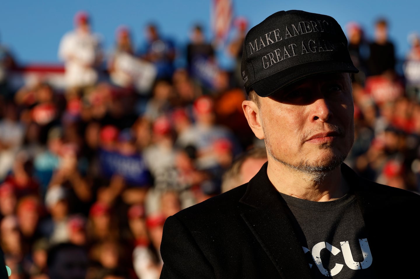 Elon Musk wears a black "Make America Great Again" ball cap while attending a campaign rally with Donald Trump at the Butler Farm Show fairgrounds on October 05, 2024, in Butler, Pennsylvania.